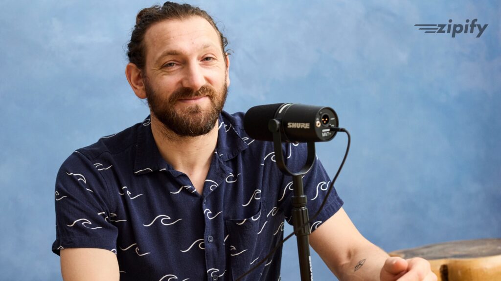 Ezra Firestone at the microphone, host of the webinar
